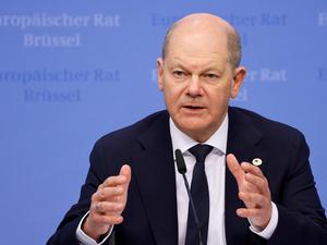 Germany’s Chancellor Olaf Scholz gestures during a press conference at the end of the European Council summit at the EU headquarters in Brussels, on April 18, 2024.