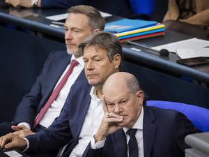 Olaf Scholz, Robert Habeck, Christian Lindner (von rechts) bei einer Debatte im Deutschen Bundestag.