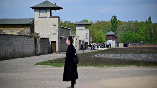 Visitors are seen at the former Sachsen-hausen Nazi concentration camp on April 23, 2024 in Oranienburg near Berlin, northeastern Germany. The site of what is now the Sachsenhausen memorial centre was one of the biggest concentration camps on German territory from 1936 to 1945. (Photo by Tobias SCHWARZ / AFP)
